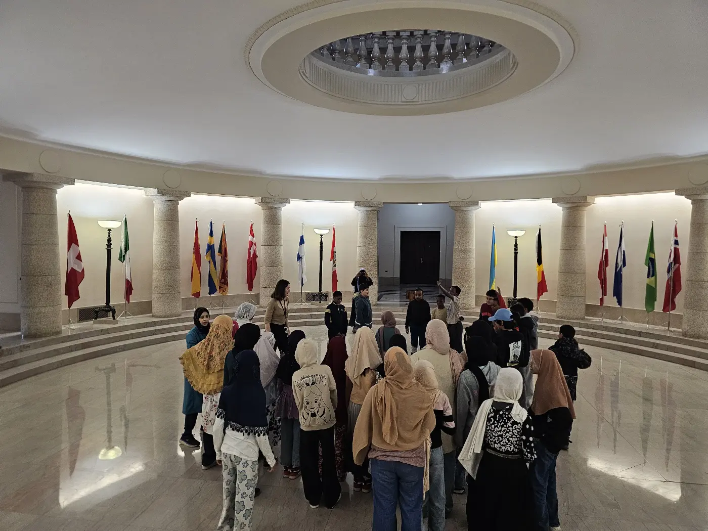 Students gathered in the rotunda of the Manitoba Legislative Building